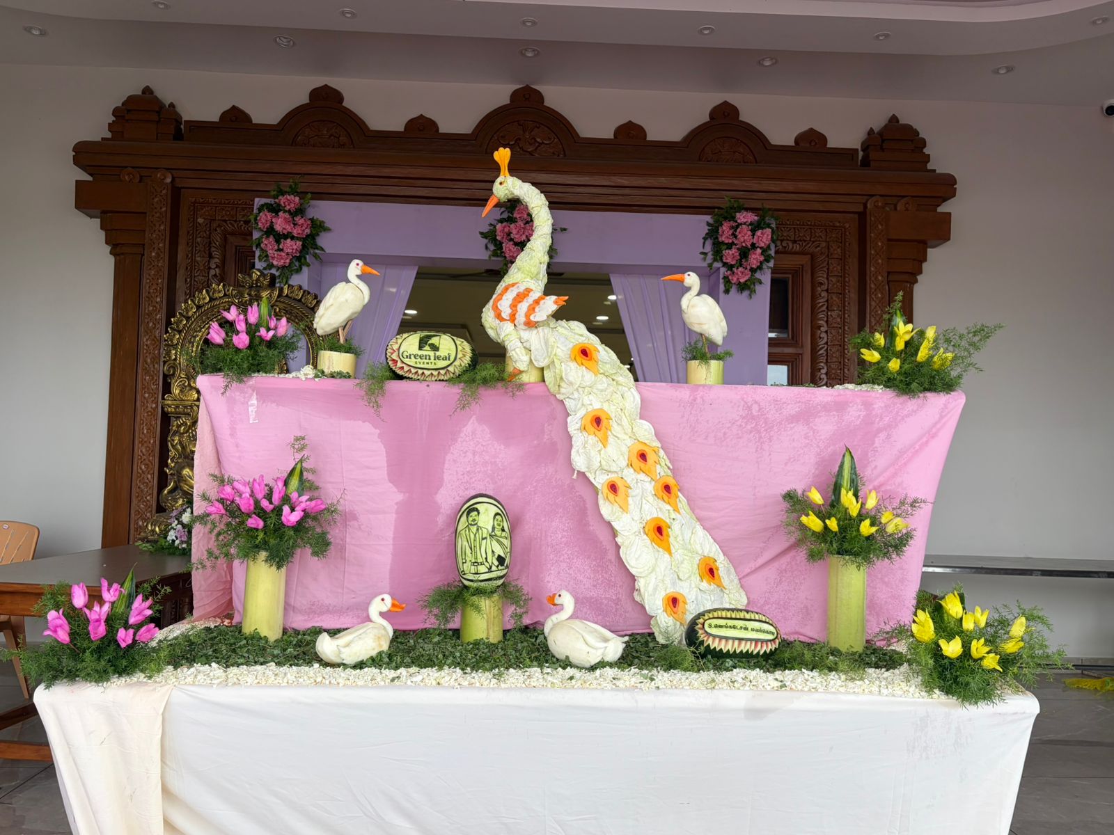 Floral peacock centrepiece for a wedding celebration